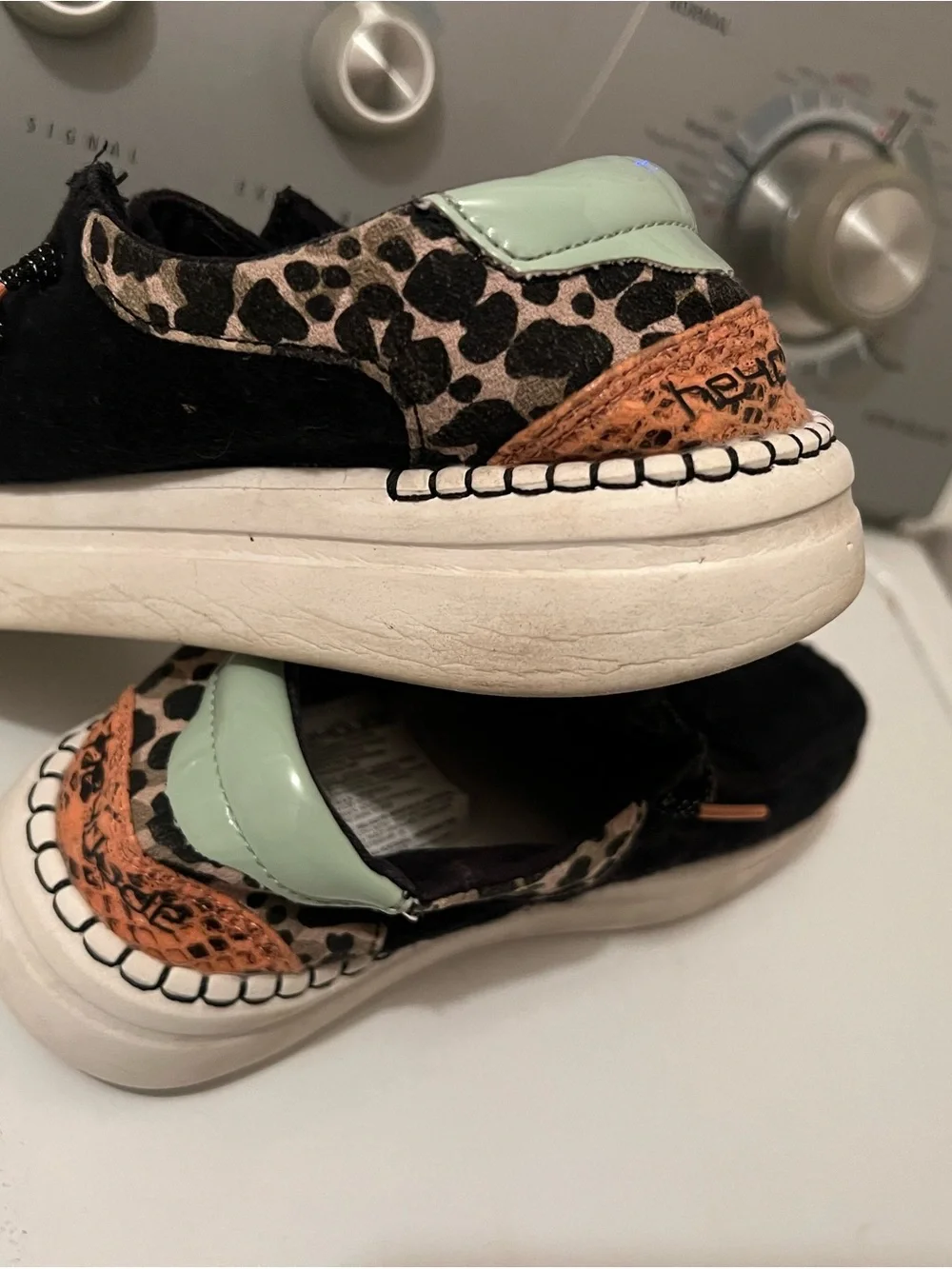 Hey Dude Black Slip-On Sneakers with Leopard Trim and Mint Heel